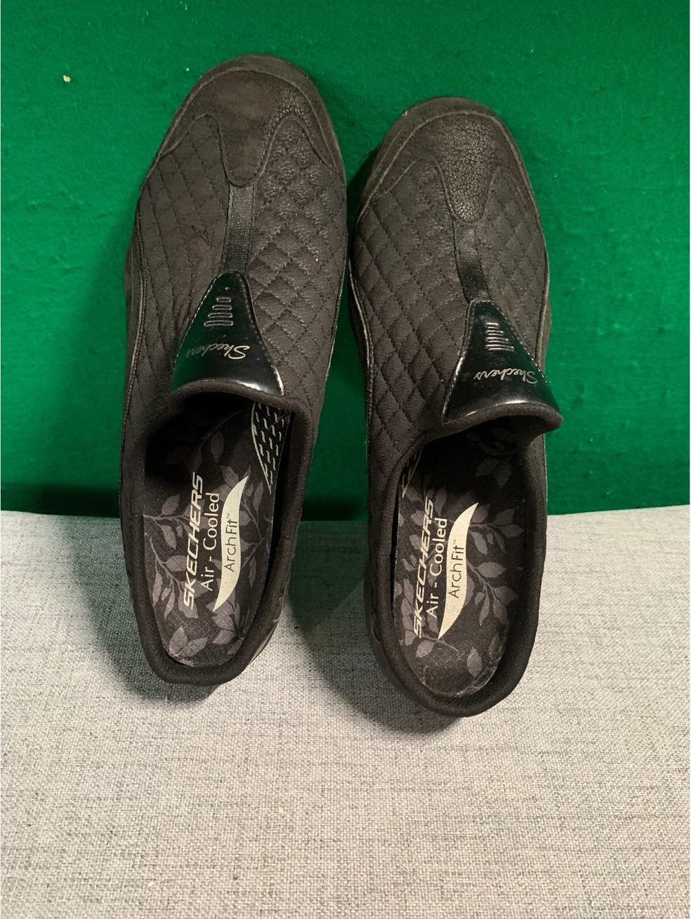 Skechers black quilted slip on shoes